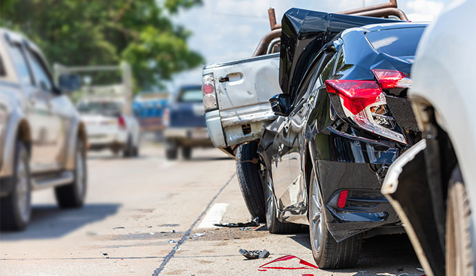 A multi-vehicle highway collision with severe rear-end damaged cars
