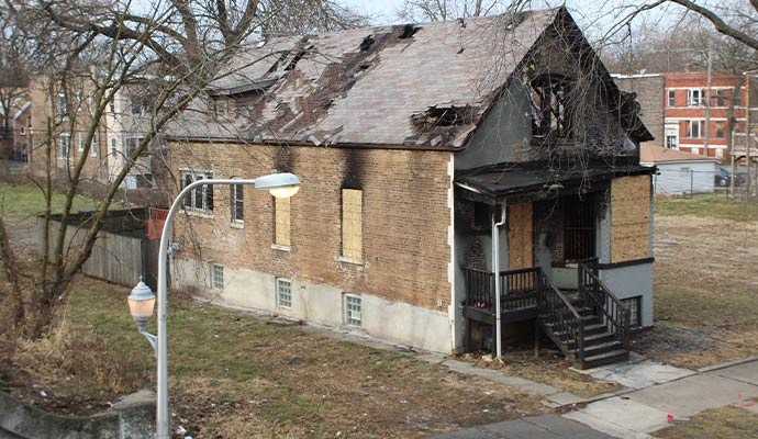 Boarded up house fire damage