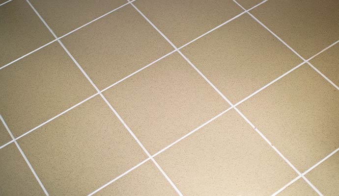 Clean beige tile flooring with neat grout lines