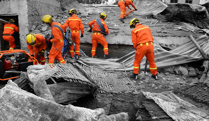 Professional team cleaning disaster damaged property