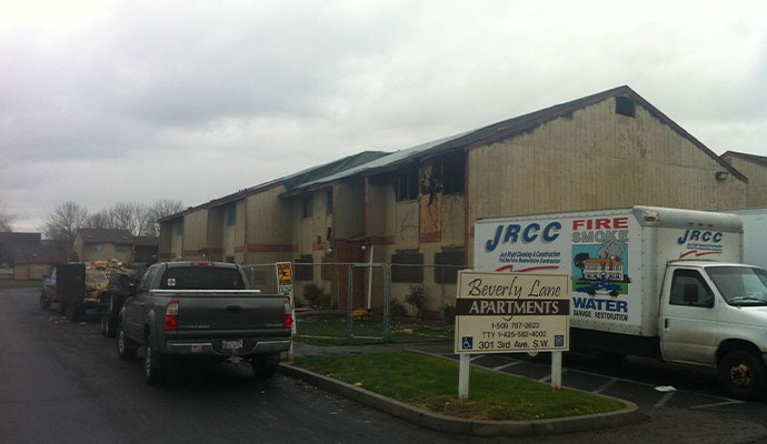 Just Right Cleaning and Construction van infront of a fire damaged house