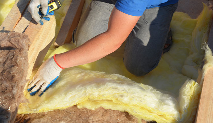 Professional installing new insulation material