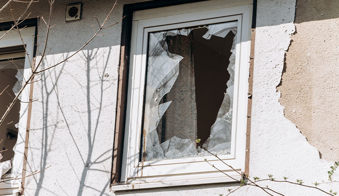 Windows are broken by debris due to wind