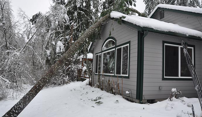 Heavy snow damaged house
