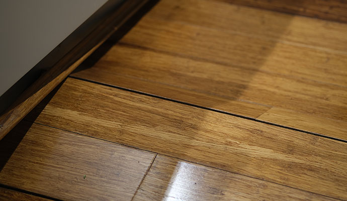 A water damaged warped buckled wood floor A water damaged warped buckled wood floor