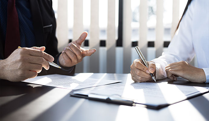 Professional team assisting with water damage insurance claim consultation.