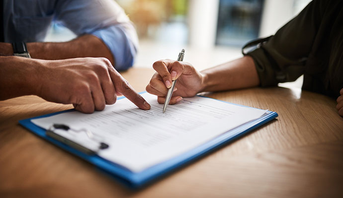 Professional team assisting with water damage insurance claim consultation.