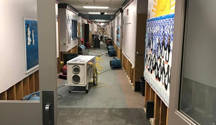 Water drying equipment in a school corridor